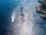 Boat sealing in Atlantic ocean view from above. Aerial view of Atlantic ocean coast Boat sealing in Atlantic ocean view from above. Aerial view of Atlantic ocean coast