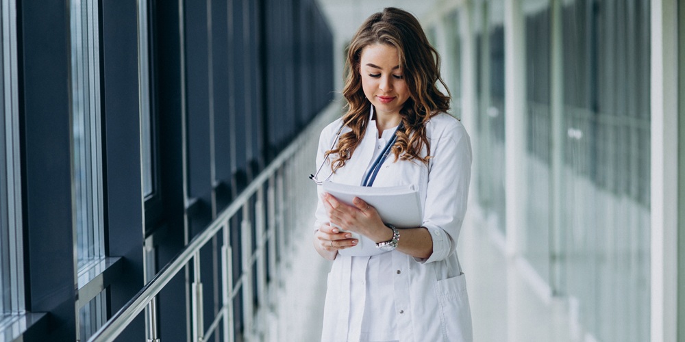 Young woman doctor with stethoscope at hospital Young woman doctor with stethoscope at hospital