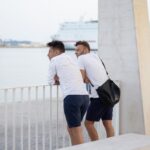 two men of a friend on the city promenade in Malaga