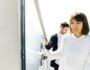 Wife and husband going up on stairs in sky Wife and husband going up on stairs in sky